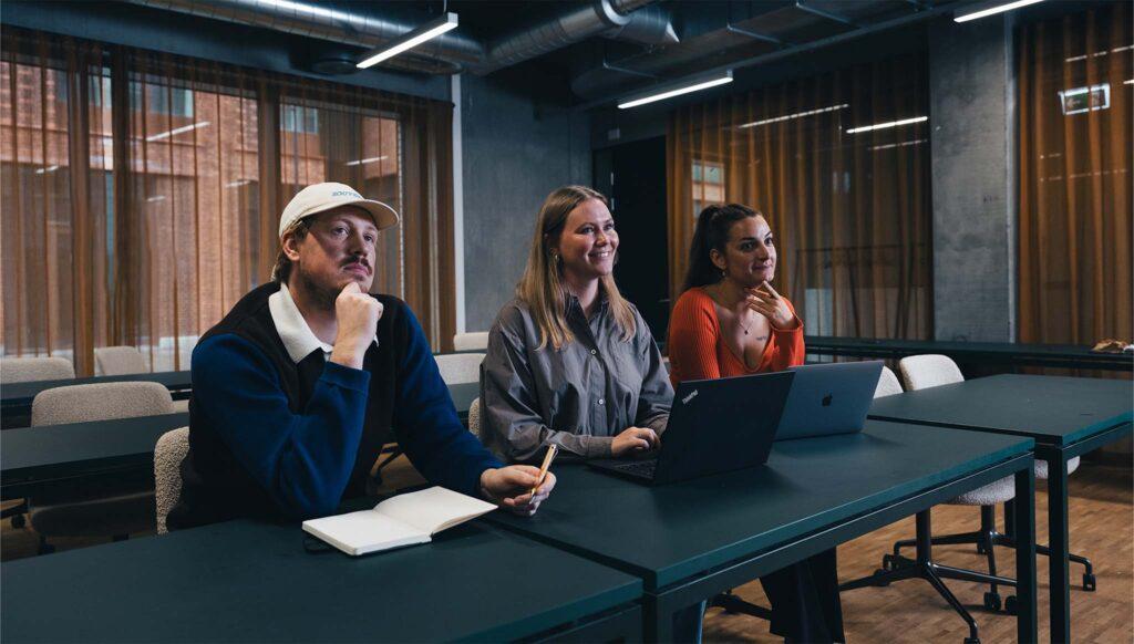 coworkers listening at a presentation