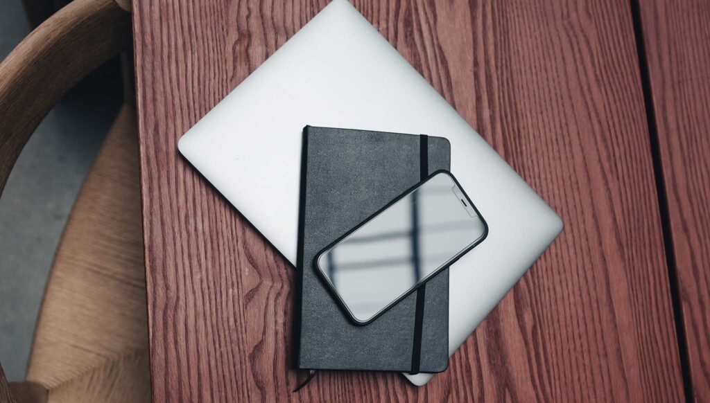 Macbook and phone on desk