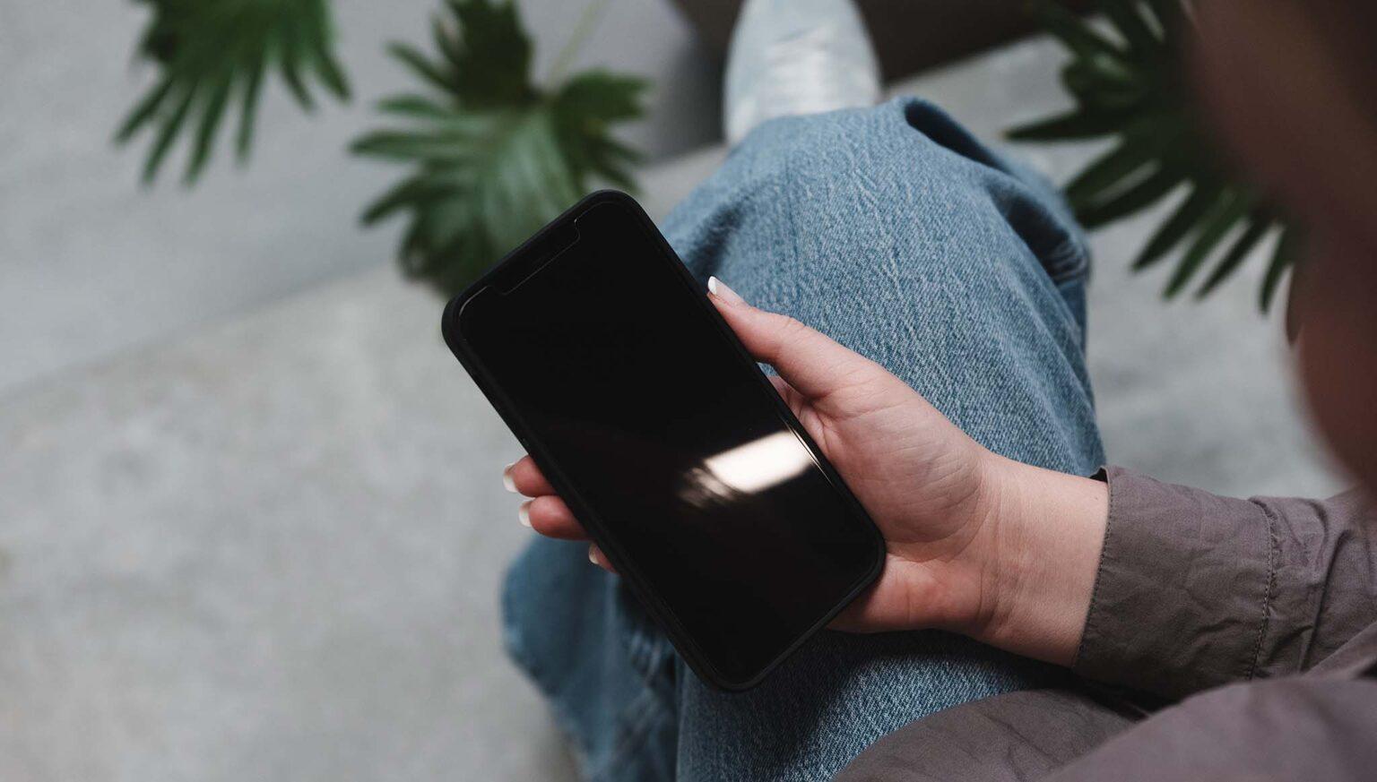 sitting with phone on lap