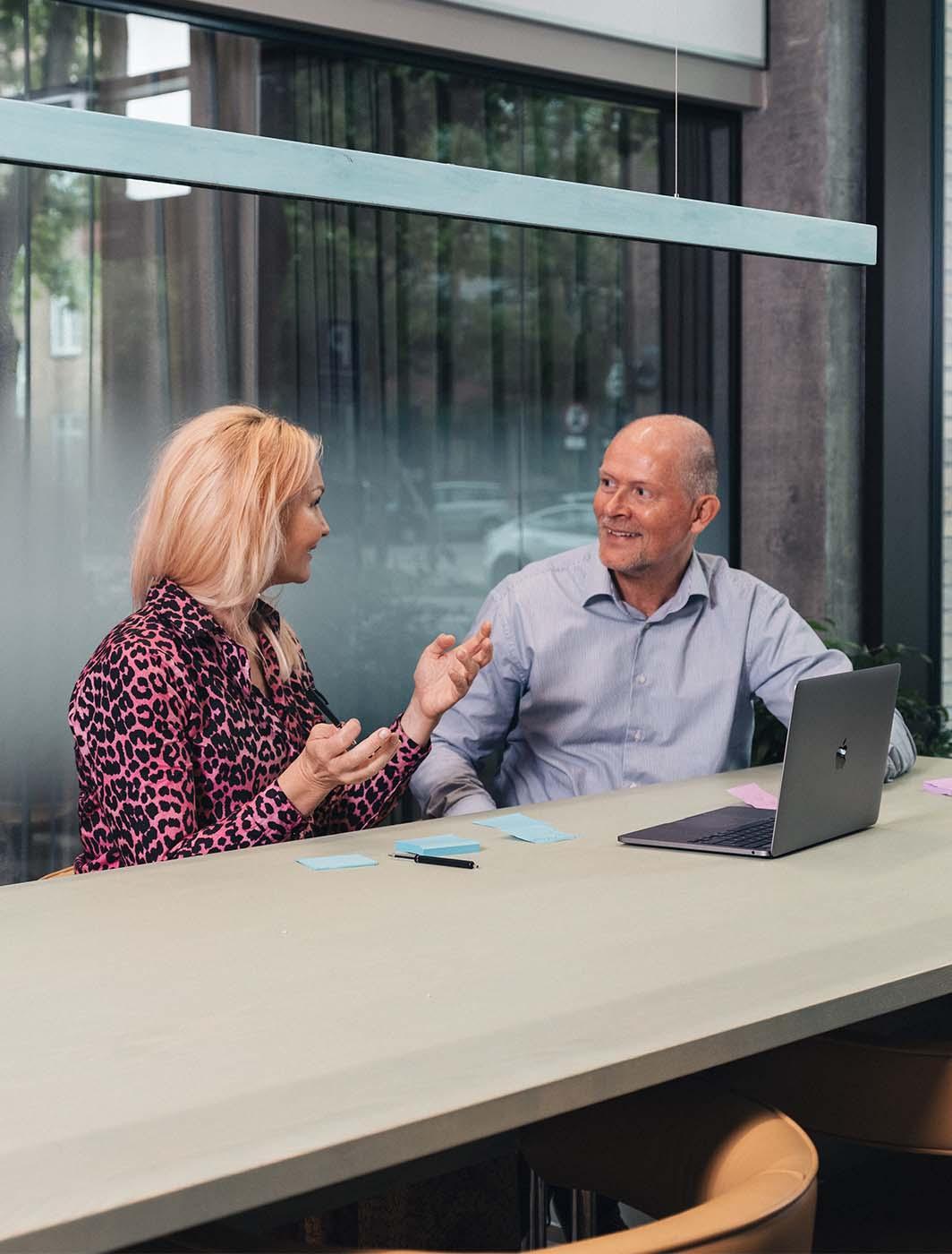 Coworkers talking in the meeting room