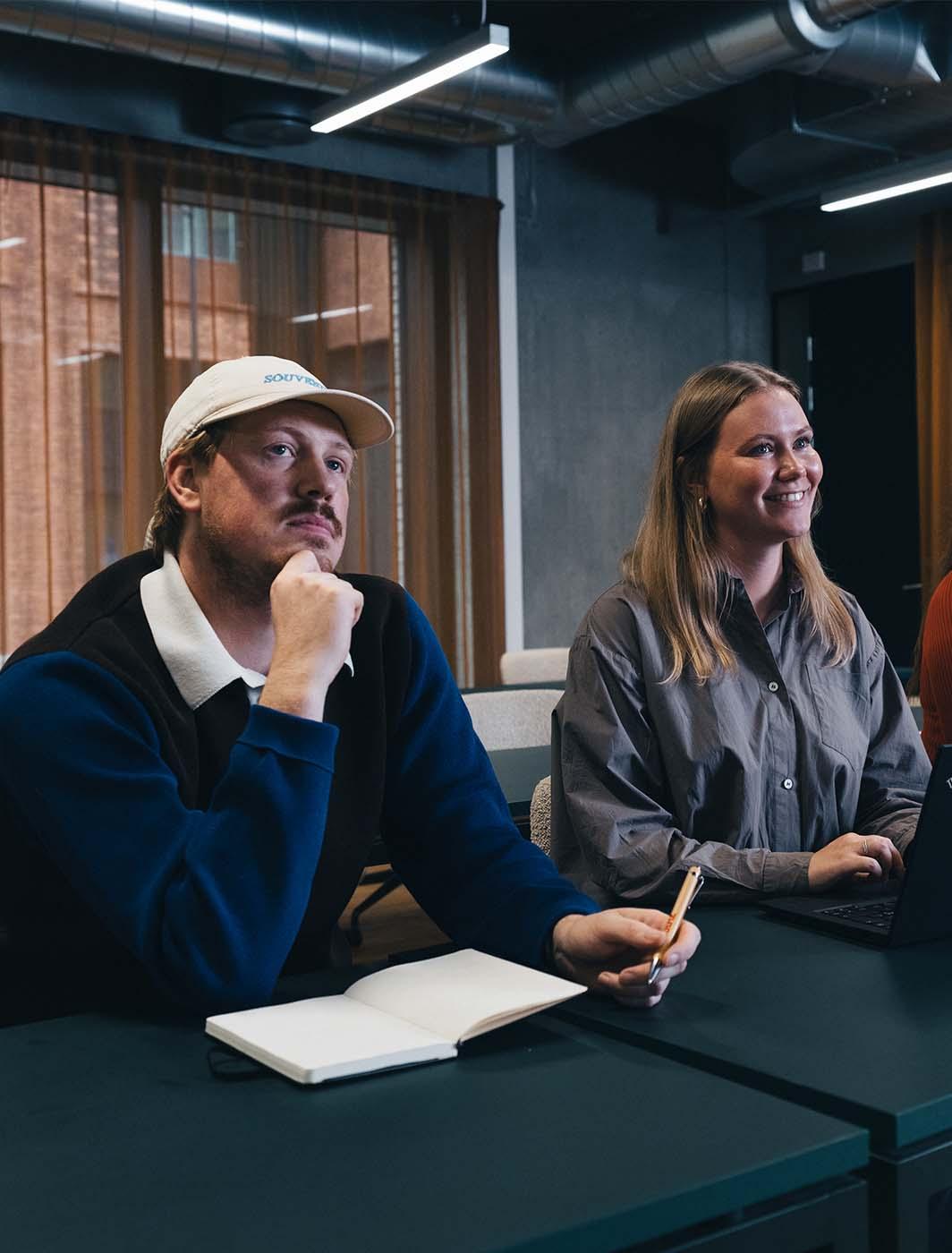 coworkers listening tp a presentation