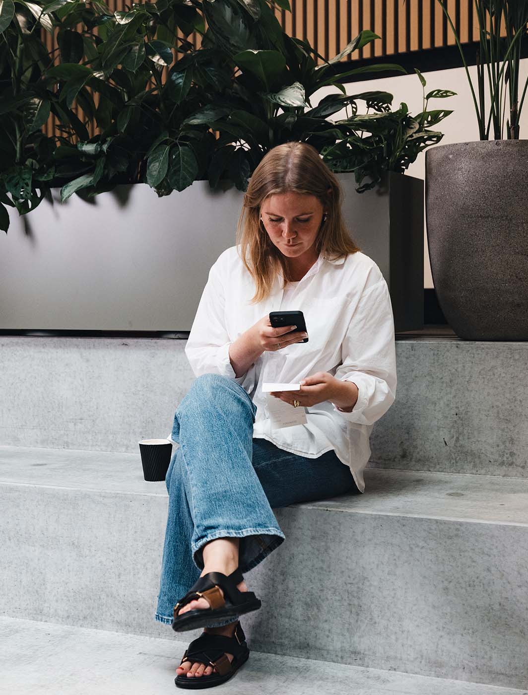 Woman taking a picture of receipt