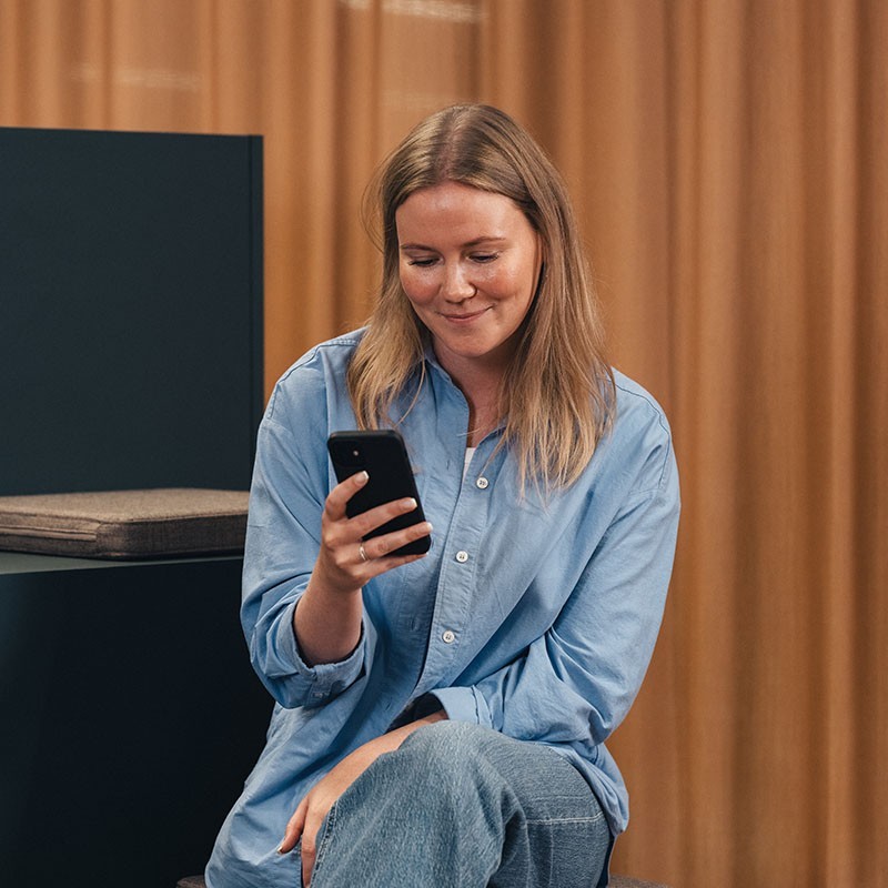 Woman sitting with phone
