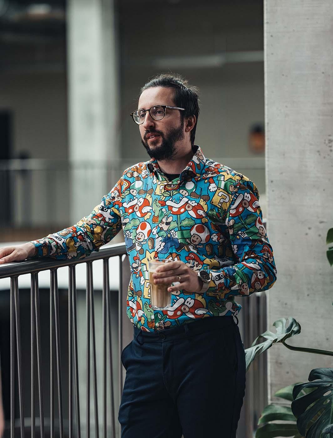 man holding a coffee