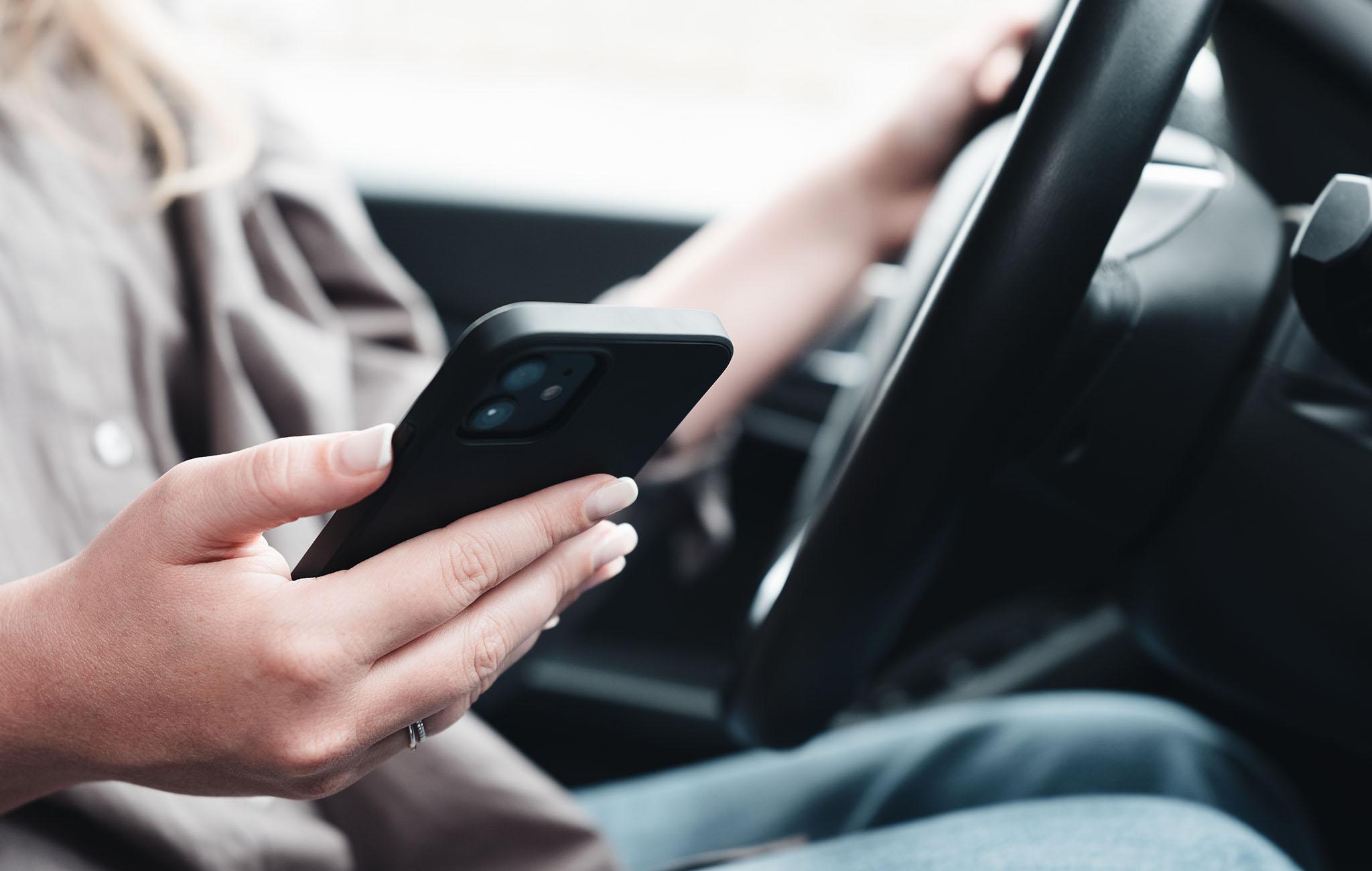 mileage log with phone in car